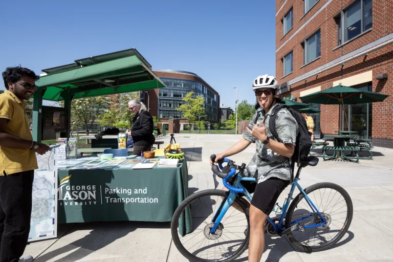 The Mason community celebrates Bike to Mason Day on the Fairfax Campus with Parking and Transporation, University Sustainability, friends from the City of Fairfax, and local vendors to learn more about campus resources and . photo by Evan Cantwell/Creative Services