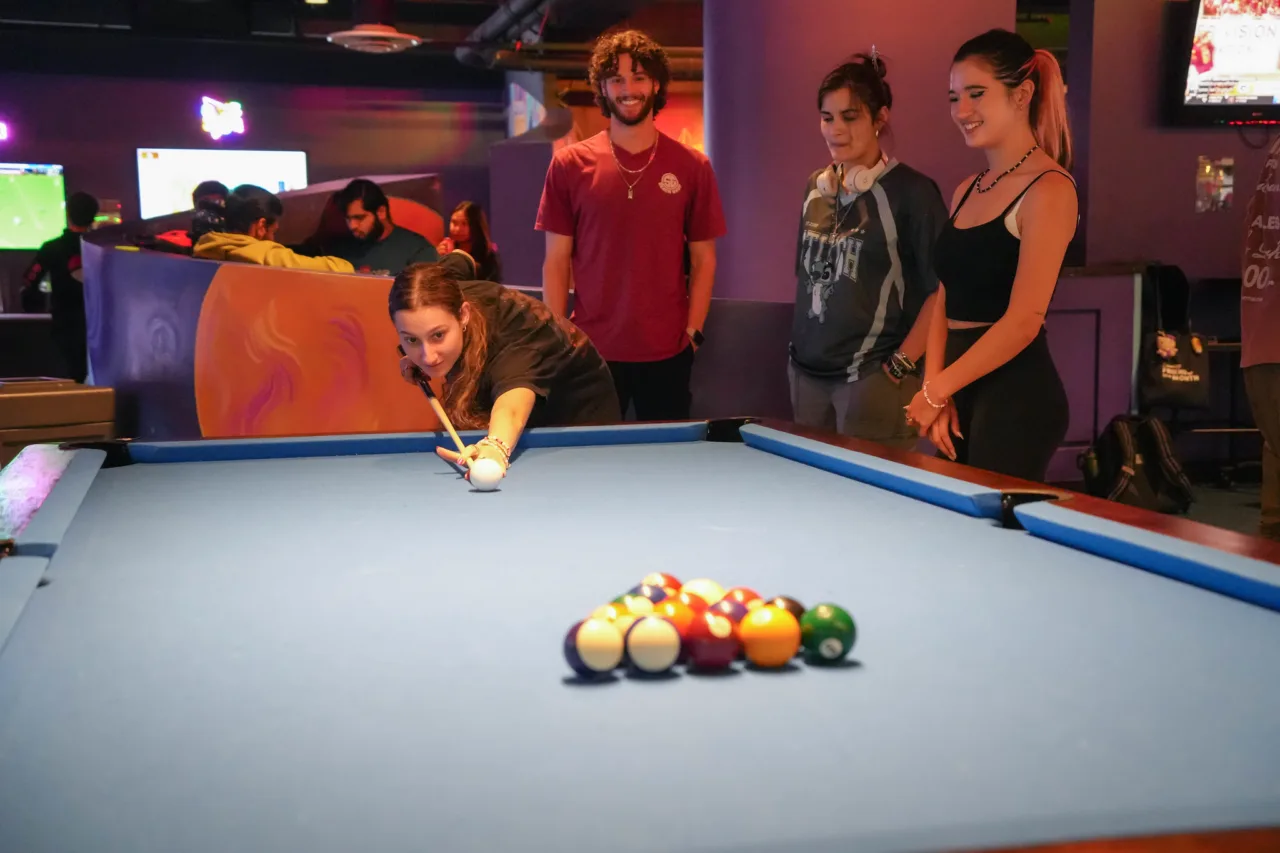 Students playing pool at the Corner Pocket