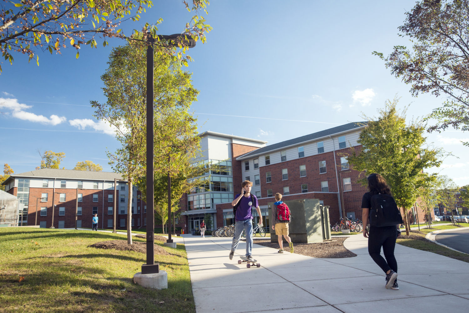 Students walking in front of Taylor Hall on the Fairfax Campus in the fall.