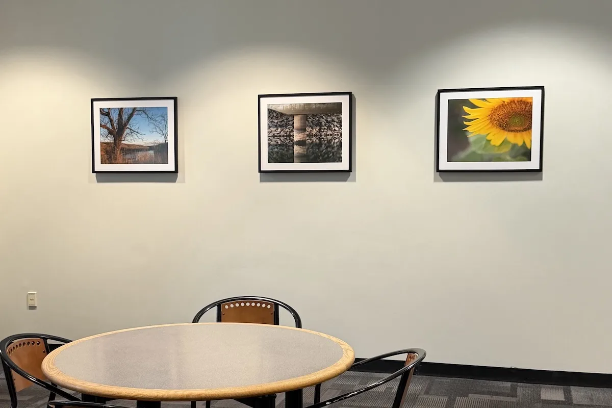 Photos of George Mason artist photography displayed at the Johnson Center's various lounges.